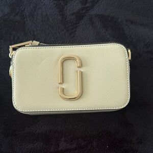 Marc Jacobs the snapshot bag  New never used.  Cream and black gold hardware.